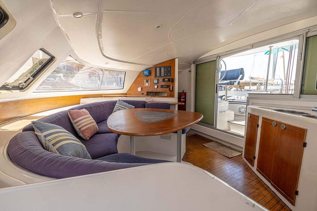 Indoor lounge area of the catamaran charter boat in Malta